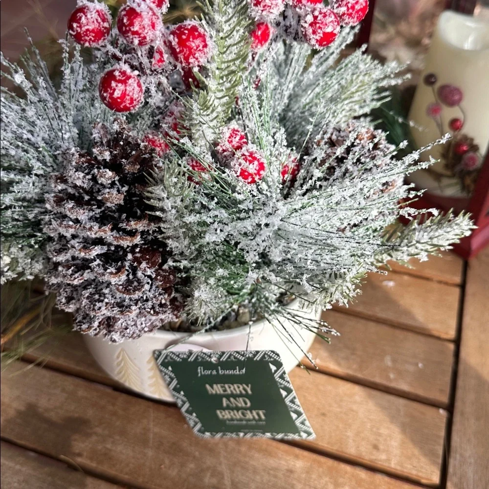 faux winter greenery in a pine tree ceramic bowl